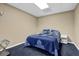 A small bedroom with a comfortable bed, simple decor, and a cozy atmosphere at 1875 Edgemont Ct, Cumming, GA 30041