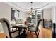 Dining room featuring a stylish chandelier, hardwood floors, and elegant decor at 1875 Edgemont Ct, Cumming, GA 30041