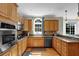 Bright and modern kitchen with stainless steel appliances, and wood cabinets at 1875 Edgemont Ct, Cumming, GA 30041
