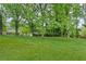 The property features a spacious backyard with mature trees and lush greenery, providing privacy and a park-like setting at 3119 Medley Rdg, Decatur, GA 30033