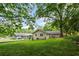 Expansive backyard showcasing the lush green lawn and mature trees, perfect for outdoor activities and relaxation at 3119 Medley Rdg, Decatur, GA 30033