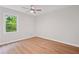 The bedroom features an attractive ceiling fan, a window, and gorgeous hardwood floors at 3119 Medley Rdg, Decatur, GA 30033