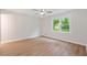 Bedroom featuring hardwood floors, natural lighting, a ceiling fan, and neutral paint at 3119 Medley Rdg, Decatur, GA 30033