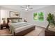 Modern bedroom with a ceiling fan, hardwood floors, a window view, and neutral colored walls at 3119 Medley Rdg, Decatur, GA 30033