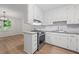 Bright kitchen with white cabinets, granite countertops, stainless steel appliances, and island at 3119 Medley Rdg, Decatur, GA 30033