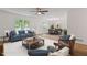 Comfortable living room with a ceiling fan, hardwood floors, a cozy couch, and a formal dining area at 3119 Medley Rdg, Decatur, GA 30033