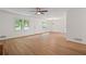 Living room featuring hardwood floors, natural lighting, a ceiling fan, and neutral paint at 3119 Medley Rdg, Decatur, GA 30033