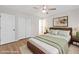 Bedroom features hardwood floors, a ceiling fan, a closet, and neutral colored walls at 3119 Medley Rdg, Decatur, GA 30033