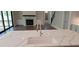Close up of an island with striking white countertop and designer sink and faucet at 4525 Aiden Way, Cumming, GA 30041