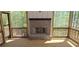 Outdoor patio with wood burning brick fireplace and screened windows offering a beautiful natural view at 4525 Aiden Way, Cumming, GA 30041