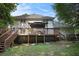 Spacious backyard features a large wooden deck, perfect for outdoor entertaining at 573 Hastings Way, Jonesboro, GA 30238