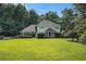 Charming two-story home with a well-manicured lawn and mature trees at 573 Hastings Way, Jonesboro, GA 30238