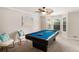 Bright game room with a billiards table and comfortable seating near bay windows at 573 Hastings Way, Jonesboro, GA 30238