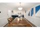 Spacious kitchen adjacent to dining area with updated appliances and modern finishes at 573 Hastings Way, Jonesboro, GA 30238