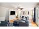 Relaxing living room with a neutral color palette, hardwood floors, and modern decor at 573 Hastings Way, Jonesboro, GA 30238