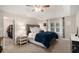 This is a view of the spacious main bedroom with a walk-in closet and a large window for natural light at 573 Hastings Way, Jonesboro, GA 30238