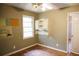 Bedroom with hardwood floors, built-in shelving and natural light at 127 Perry St, Loganville, GA 30052