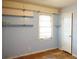 Bedroom with hardwood floors, neutral walls, and a bright window at 127 Perry St, Loganville, GA 30052