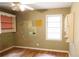 Bedroom with hardwood floors, natural light and built-in shelving at 127 Perry St, Loganville, GA 30052
