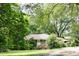 Charming brick home with lush landscaping and a welcoming entrance at 127 Perry St, Loganville, GA 30052
