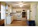 Functional kitchen with white appliances, ample cabinet space, and hardwood flooring at 127 Perry St, Loganville, GA 30052