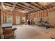 Spacious unfinished basement with exposed ceiling rafters, and concrete floors at 1858 Glenview Park Cir, Duluth, GA 30097