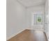 Bright bedroom with hardwood floors and neutral paint, with access to a large closet at 1858 Glenview Park Cir, Duluth, GA 30097