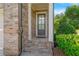 Inviting entryway features brick steps, stylish front door, and lush greenery at 1858 Glenview Park Cir, Duluth, GA 30097