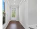 Bright foyer with hardwood floors and a view of the front door at 1858 Glenview Park Cir, Duluth, GA 30097