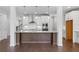Modern kitchen with stainless appliances, island, and hardwood floors at 1858 Glenview Park Cir, Duluth, GA 30097
