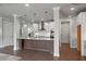 Bright, open kitchen with a large island, stainless hood, and white cabinetry at 1858 Glenview Park Cir, Duluth, GA 30097
