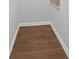 Dark laminate landing with white trim, ready for a rug at 1858 Glenview Park Cir, Duluth, GA 30097