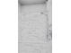 A tiled shower with a built-in seat and glass door at 1858 Glenview Park Cir, Duluth, GA 30097