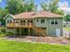 A spacious home featuring a wooden deck overlooking the backyard at 2930 Heather Stone Way, Lawrenceville, GA 30043