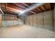 Unfinished basement showcasing the concrete foundation, exposed ceiling and utilities at 2930 Heather Stone Way, Lawrenceville, GA 30043