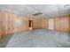 Spacious basement features carpet and wood paneling, offering potential for customization at 2930 Heather Stone Way, Lawrenceville, GA 30043