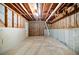 Unfinished basement featuring exposed beams, concrete walls, and potential for customization at 2930 Heather Stone Way, Lawrenceville, GA 30043