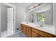 Bathroom features double sink vanity, and large mirror at 2930 Heather Stone Way, Lawrenceville, GA 30043