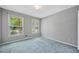 Carpeted bedroom with two windows at 2930 Heather Stone Way, Lawrenceville, GA 30043