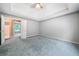 Spacious main bedroom with a tray ceiling and large windows at 2930 Heather Stone Way, Lawrenceville, GA 30043