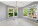 Sun-filled breakfast nook boasts three large windows overlooking a lush backyard at 2930 Heather Stone Way, Lawrenceville, GA 30043