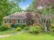 Charming one-story brick home with manicured lawn and mature landscaping at 2930 Heather Stone Way, Lawrenceville, GA 30043