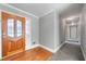 Inviting foyer featuring hardwood floors, a decorative front door, and fresh paint at 2930 Heather Stone Way, Lawrenceville, GA 30043
