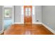 Light filled foyer showcasing hardwood floors and a decorative front door at 2930 Heather Stone Way, Lawrenceville, GA 30043