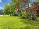 Lush front lawn with mature trees and landscaping enhancing curb appeal at 2930 Heather Stone Way, Lawrenceville, GA 30043