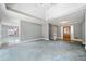 Spacious living room featuring a tray ceiling, fresh paint and lots of natural light at 2930 Heather Stone Way, Lawrenceville, GA 30043