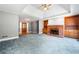 Open-concept living room boasting a fireplace and built-in cabinets at 2930 Heather Stone Way, Lawrenceville, GA 30043