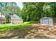 Side yard with storage shed and lush landscaping at 3139 Fairview Dr, Snellville, GA 30078