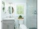 Updated bathroom featuring a glass enclosed shower and modern vanity with granite countertop at 3139 Fairview Dr, Snellville, GA 30078