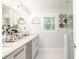 Bright bathroom featuring double vanity, neutral color palette, and natural light at 3139 Fairview Dr, Snellville, GA 30078